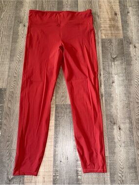 Vuori women’s large rust colored Athletic Performance leggings